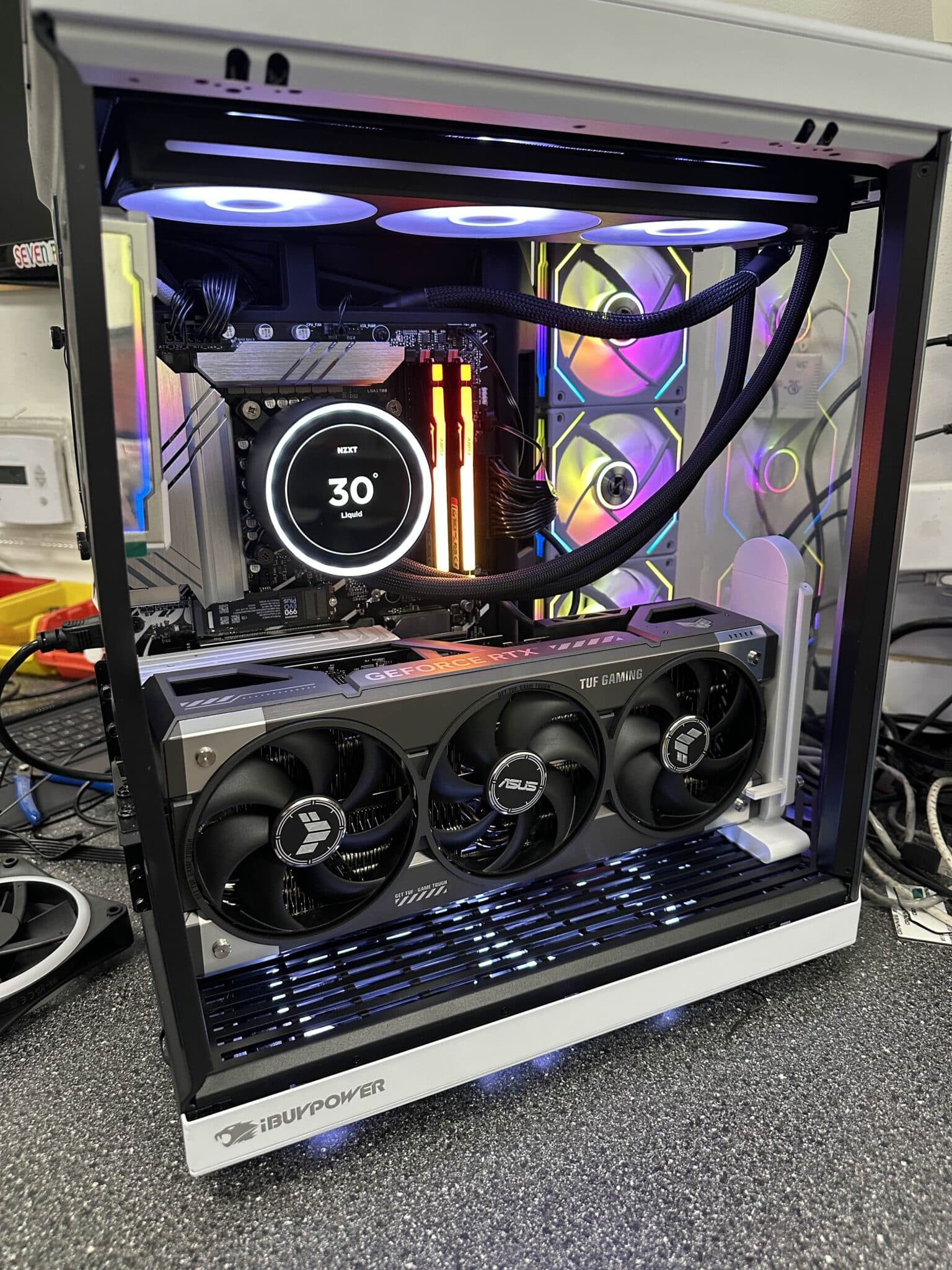 Customer's gaming PC with a liquid cooler and triple-fan graphics card on the SnapTech bench after an upgrade