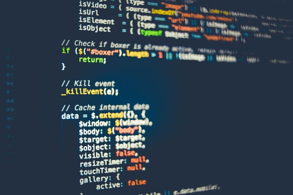 Lines of program code on a dark screen (stock photo, to be replaced)